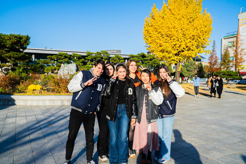 students take a photo together on campus