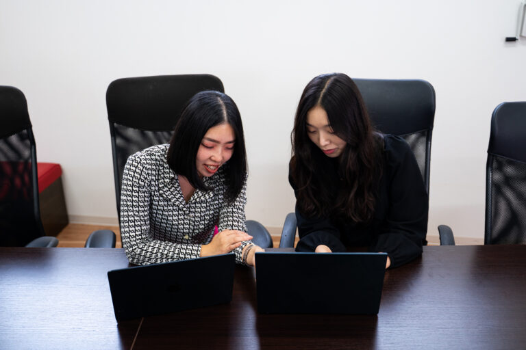 two team members working together